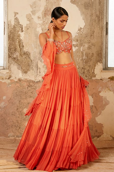 Shloka Khialani_Peach Net, Crepe, Georgette Floral V Neck Millie Tiered Lehenga Set _Online_at_Aza_Fashions