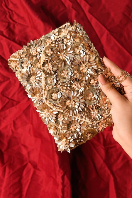 Shop The Purple Sack Gold Sequins, Pearls, Cut Work Blaze Floral Embellished Clutch With Sling at Aza Fashions Shop_The Purple Sack_Gold Sequins, Pearls, Cut Work Blaze Floral Embellished Clutch With Sling _at_Aza_Fashions