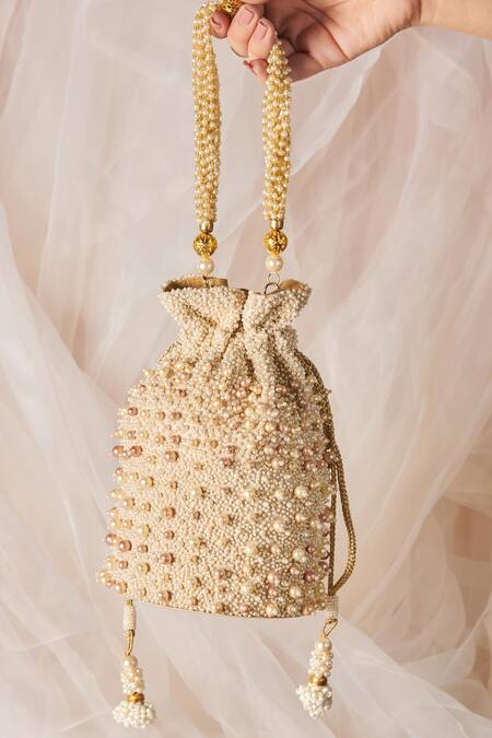 Shop The Purple Sack White Pearls Embellished Potli With Sling at Aza Fashions Shop_The Purple Sack_White Pearls Embellished Potli With Sling _at_Aza_Fashions