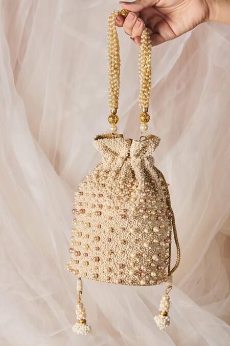 The Purple Sack White Pearls Embellished Potli With Sling Online at Aza Fashions The Purple Sack_White Pearls Embellished Potli With Sling _Online_at_Aza_Fashions