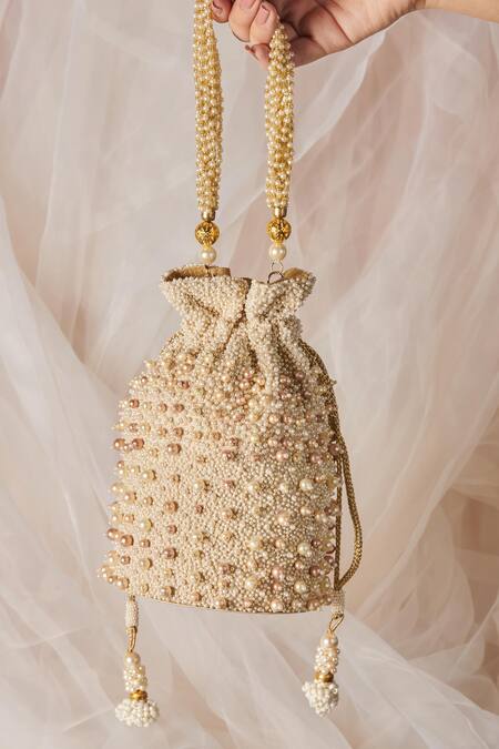 Buy The Purple Sack White Pearls Embellished Potli With Sling Online at Aza Fashions Buy_The Purple Sack_White Pearls Embellished Potli With Sling _Online_at_Aza_Fashions