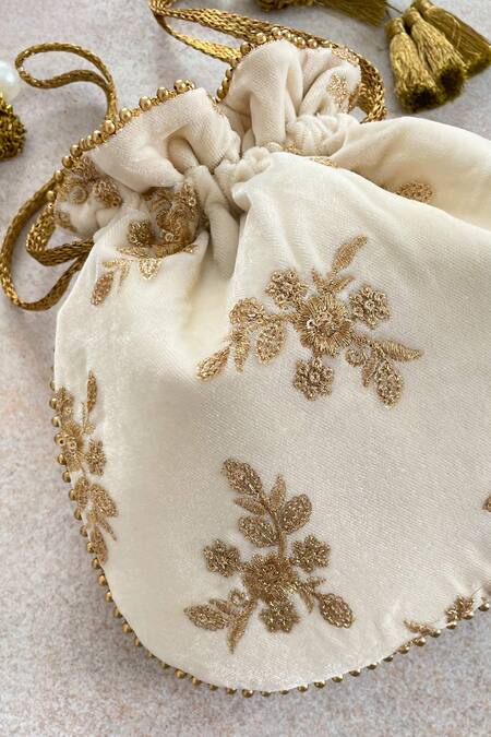 Buy Off White Embroidered Velvet Potli Bag by Amyra Online at Aza - Main Image