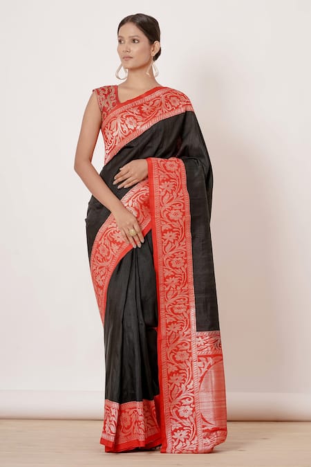 Gold soft silk saree features embellished leaf zari buttas, contrast zari  border & pallu of intricate designs