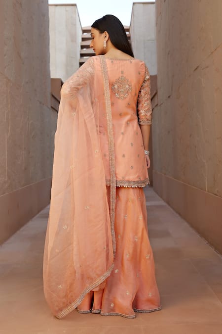 Shop Sana Barreja Peach Net, Lining Crepe Floral Motifs V Ruhee Embroidered Jacket Gharara Set at Aza Fashions Shop_Sana Barreja_Peach Net, Lining Crepe Floral Motifs V Ruhee Embroidered Jacket Gharara Set _at_Aza_Fashions