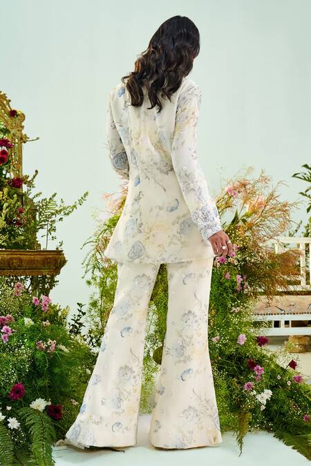 Shop Mani Bhatia Ivory Chiffon Print And Embroidery Cutdana V Eliana Peplum Top & Flared Pant Set at Aza Fashions Shop_Mani Bhatia_Ivory Chiffon Print And Embroidery Cutdana V Eliana Peplum Top & Flared Pant Set _at_Aza_Fashions