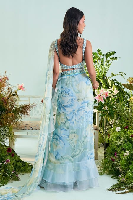 Shop Mani Bhatia Blue Chiffon Embroidery Cutdana V Neck Aria Floral Print Ruffle Saree Set at Aza Fashions Shop_Mani Bhatia_Blue Chiffon Embroidery Cutdana V Neck Aria Floral Print Ruffle Saree Set _at_Aza_Fashions