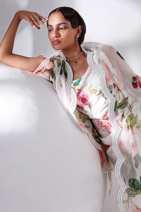 Buy Tisha Saksena Ivory Cape Silk Organza, Gown Dupion Silk, Lining Viscose Rose Printed With Online at Aza Fashions Buy_Tisha Saksena_Ivory Cape Silk Organza, Gown Dupion Silk, Lining Viscose Rose Printed With _Online_at_Aza_Fashions
