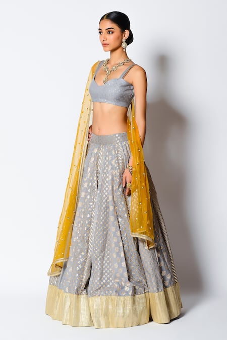 Grey color Lehenga choli with Peach Blouse and Net Dupatta