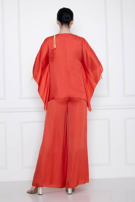 Shop Dilnaz Red Cotton Satin V Neck Front Twist Kaftan Top With Jumpsuit at Aza Fashions Shop_Dilnaz_Red Cotton Satin V Neck Front Twist Kaftan Top With Jumpsuit_at_Aza_Fashions
