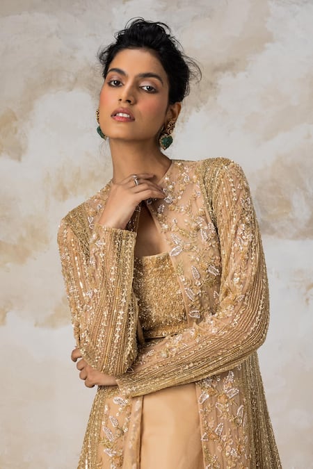 Shop COUTURE BY NIHARIKA Gold Organza, Net Floral Pattern Embroidered Jacket With Skirt Set at Aza Fashions Shop_COUTURE BY NIHARIKA_Gold Organza, Net Floral Pattern Embroidered Jacket With Skirt Set _at_Aza_Fashions