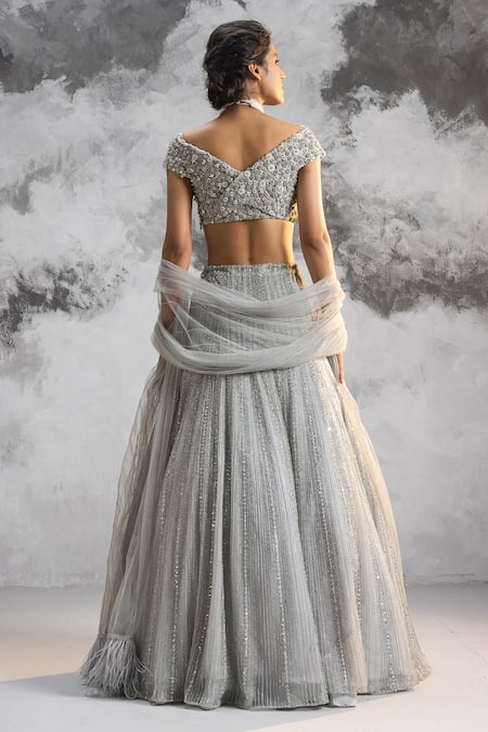 Shop_COUTURE BY NIHARIKA_Blue Net Embroidery Cutdana One Shoulder Bridal Lehenga Set  _at_Aza_Fashions