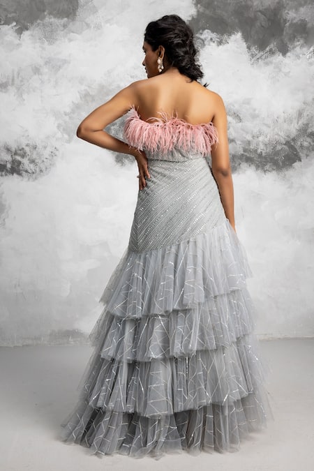 Shop COUTURE BY NIHARIKA Blue Net Sequins, Bead One Shoulder Feather Embellished Blouse And Frill Skirt Set at Aza Fashions Shop_COUTURE BY NIHARIKA_Blue Net Sequins, Bead One Shoulder Feather Embellished Blouse And Frill Skirt Set _at_Aza_Fashions