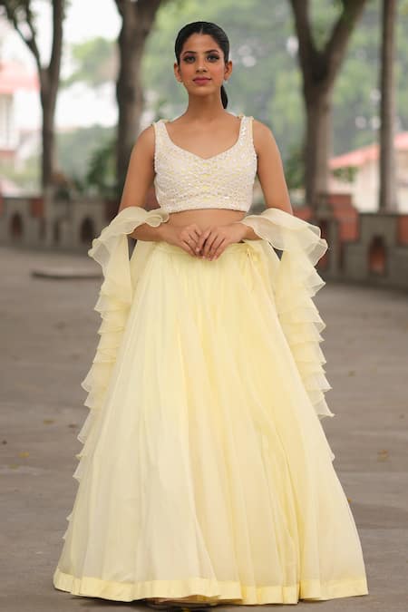 Floral Embroidered Yellow Blouse with White Mirror Lehenga and Net  Embroidered Dupatta | Vogue India