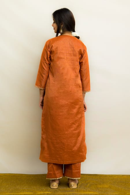 Shop Mithi Supari Orange Tissue, Silk Embroidery, Sequins, Mirrors V-neck Kesar Kurta Pant Set at Aza Fashions Shop_Mithi Supari_Orange Tissue, Silk Embroidery, Sequins, Mirrors V-neck Kesar Kurta Pant Set _at_Aza_Fashions