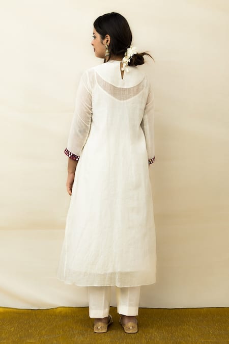 Shop Mithi Supari Ivory Chanderi Mirrors V-neck Meer Yoke Embroidered Tunic Pant Set at Aza Fashions Shop_Mithi Supari_Ivory Chanderi Mirrors V-neck Meer Yoke Embroidered Tunic Pant Set _at_Aza_Fashions