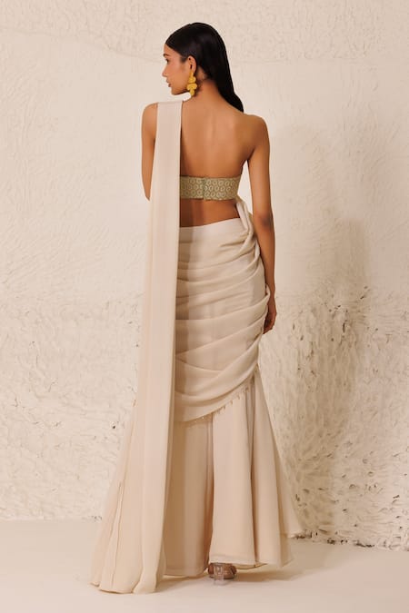 Shop Chhaya Mehrotra Off White , Satin Pre-draped Godet Saree With Embellished Bustier at Aza Fashions Shop_Chhaya Mehrotra_Off White , Satin Pre-draped Godet Saree With Embellished Bustier _at_Aza_Fashions