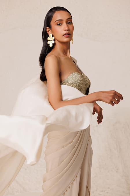 Shop Chhaya Mehrotra Off White , Satin Pre-draped Godet Saree With Embellished Bustier Online at Aza Fashions Shop_Chhaya Mehrotra_Off White , Satin Pre-draped Godet Saree With Embellished Bustier _Online_at_Aza_Fashions
