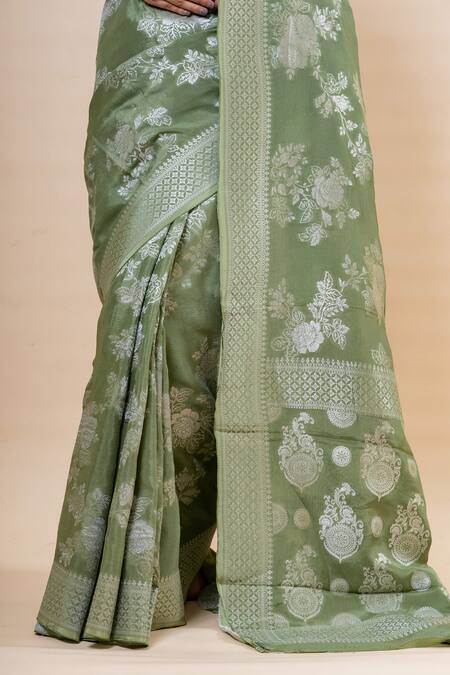 Taba Kashi By Artika Shah_Green Crepe Woven Flower Pattern Saree With Unstitched Blouse Fabric _at_Aza_Fashions