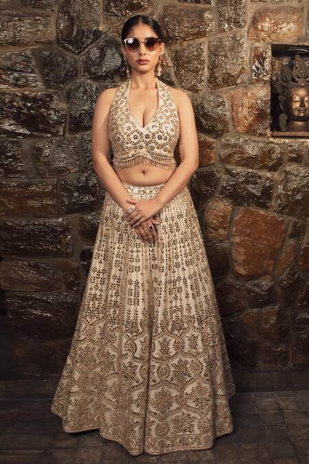 Vandana Sethi Ivory Silk Crystals, Mirrors Halter Neck Embellished Floral Lehenga Set at Aza Fashions Vandana Sethi_Ivory Silk Crystals, Mirrors Halter Neck Embellished Floral Lehenga Set _at_Aza_Fashions