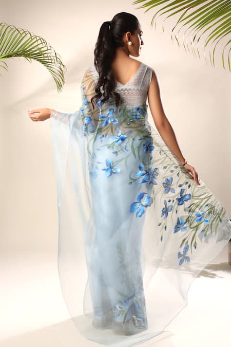 Shop Kyra By Nina + Deepika Blue Silk Organza Blooming Iris Hand Painted Saree With Unstitched Blouse Fabric at Aza Fashions Shop_Kyra By Nina + Deepika_Blue Silk Organza Blooming Iris Hand Painted Saree With Unstitched Blouse Fabric _at_Aza_Fashions