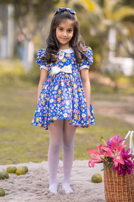 Shop The Pony & Peony Co. Blue Cotton Bows Floral Pattern Dress at Aza Fashions Shop_The Pony & Peony Co._Blue Cotton Bows Floral Pattern Dress _at_Aza_Fashions