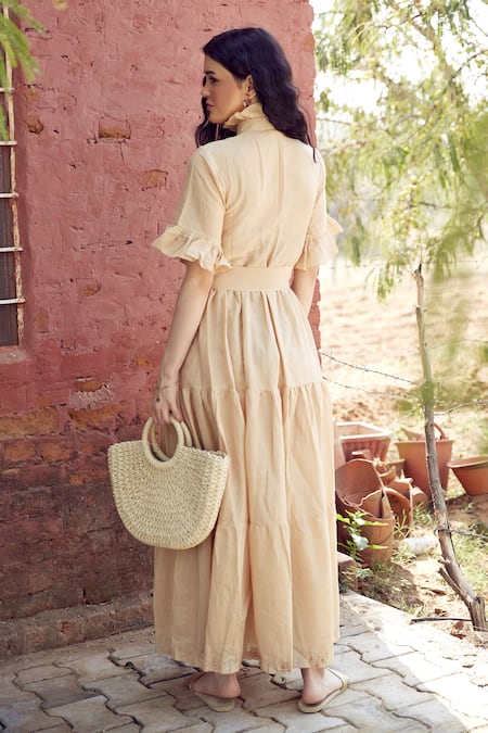 Shop Palak Khandelwal Beige Cotton, Silk Ruffles Round Neck Tiered Floral Embroidered Dress at Aza Fashions Shop_Palak Khandelwal_Beige Cotton, Silk Ruffles Round Neck Tiered Floral Embroidered Dress _at_Aza_Fashions