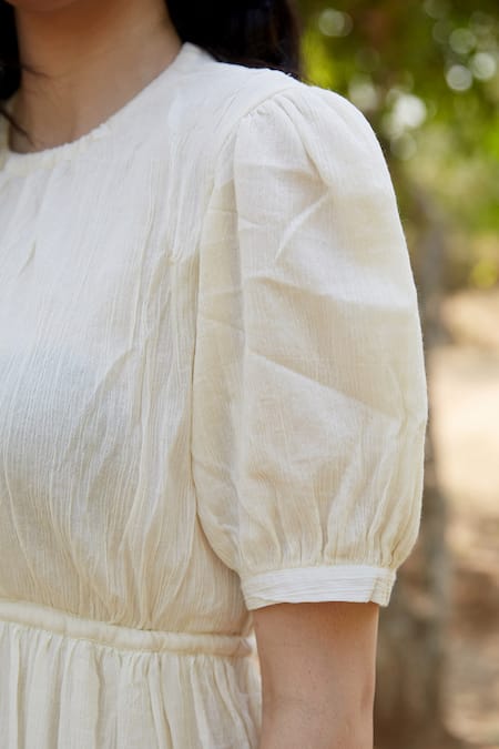 Palak Khandelwal_Ivory Cotton Round Neck Tiered Backless Dress _at_Aza_Fashions