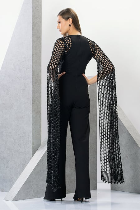 Shop Eli Bitton Black Rayon, Nylon, Spandex, Polyester Embroidery Lizette Cape Sleeve Jumpsuit at Aza Fashions Shop_Eli Bitton_Black Rayon, Nylon, Spandex, Polyester Embroidery Lizette Cape Sleeve Jumpsuit _at_Aza_Fashions