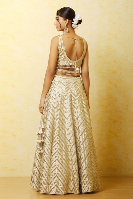 Buy Vandana Sethi Ivory Silk Embroidery, Zari V-neck Zardozi Geometric Embellished Lehenga Set Buy_Vandana Sethi_Ivory Silk Embroidery, Zari V-neck Zardozi Geometric Embellished Lehenga Set