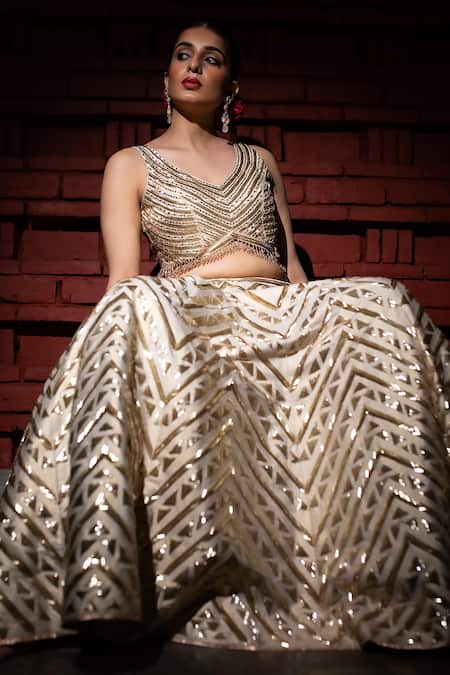 Buy Vandana Sethi Ivory Silk Embroidery, Zari V-neck Zardozi Geometric Embellished Lehenga Set Online at Aza Fashions Buy_Vandana Sethi_Ivory Silk Embroidery, Zari V-neck Zardozi Geometric Embellished Lehenga Set _Online_at_Aza_Fashions