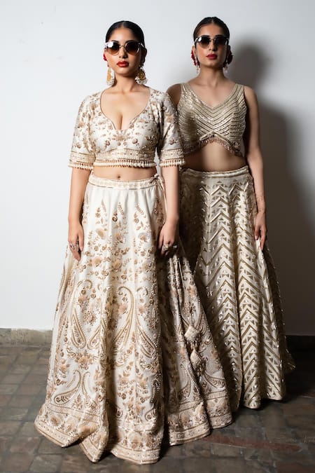 Shop Vandana Sethi Ivory Silk Embroidery, Zari V-neck Zardozi Geometric Embellished Lehenga Set Online at Aza Fashions Shop_Vandana Sethi_Ivory Silk Embroidery, Zari V-neck Zardozi Geometric Embellished Lehenga Set _Online_at_Aza_Fashions