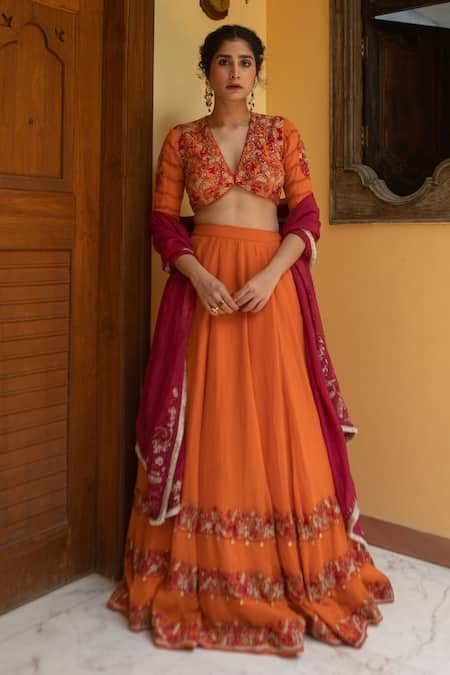 Peach embroidered lehenga with red blouse and pale orange dupatta available  only at Pernia's Pop Up Shop. 2024