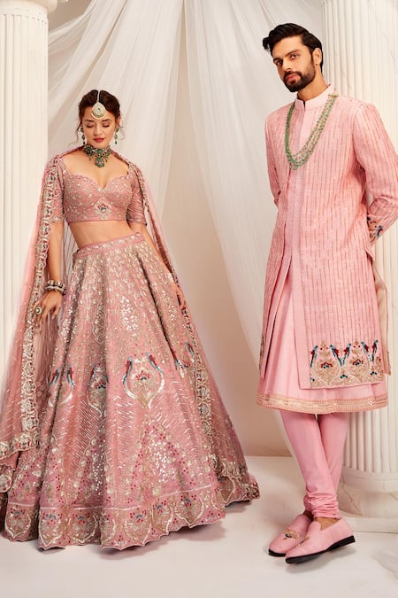 Bride in Rose Colored Lehenga, Jewelry, and Groom in White Ivory Sherwani,  Indian Wedding