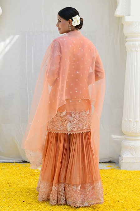 Shop Label Niti Bothra Peach Silk Embroidery V-neck Banaras Short Kurta Sharara Set at Aza Fashions Shop_Label Niti Bothra_Peach Silk Embroidery V-neck Banaras Short Kurta Sharara Set _at_Aza_Fashions