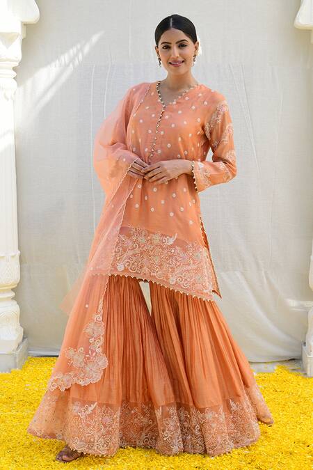 Shop Label Niti Bothra Peach Silk Embroidery V-neck Banaras Short Kurta Sharara Set Online at Aza Fashions Shop_Label Niti Bothra_Peach Silk Embroidery V-neck Banaras Short Kurta Sharara Set _Online_at_Aza_Fashions