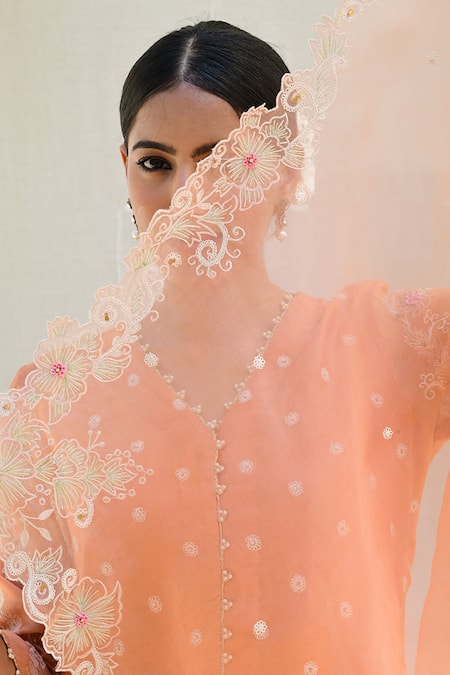 Label Niti Bothra Peach Silk Embroidery V-neck Banaras Short Kurta Sharara Set at Aza Fashions Label Niti Bothra_Peach Silk Embroidery V-neck Banaras Short Kurta Sharara Set _at_Aza_Fashions