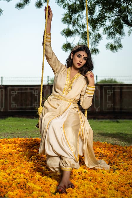 Shop The Home Affair Ivory Crepe Gota Patti, Sequins, Embroidery V-neck Draped Marodi Work Kurta Set Online at Aza Fashions Shop_The Home Affair_Ivory Crepe Gota Patti, Sequins, Embroidery V-neck Draped Marodi Work Kurta Set _Online_at_Aza_Fashions