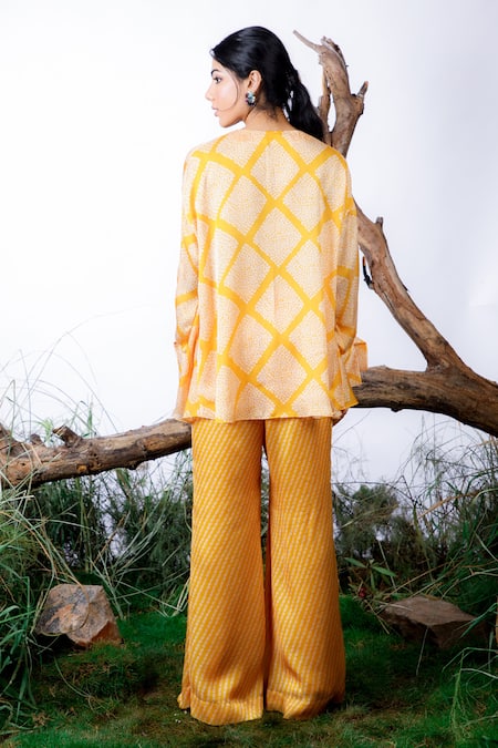 Shop Omana By Ranjana Bothra Yellow Satin, Georgette, Crepe Bandhani Print Asymmetric Top With Pant at Aza Fashions Shop_Omana By Ranjana Bothra_Yellow Satin, Georgette, Crepe Bandhani Print Asymmetric Top With Pant _at_Aza_Fashions