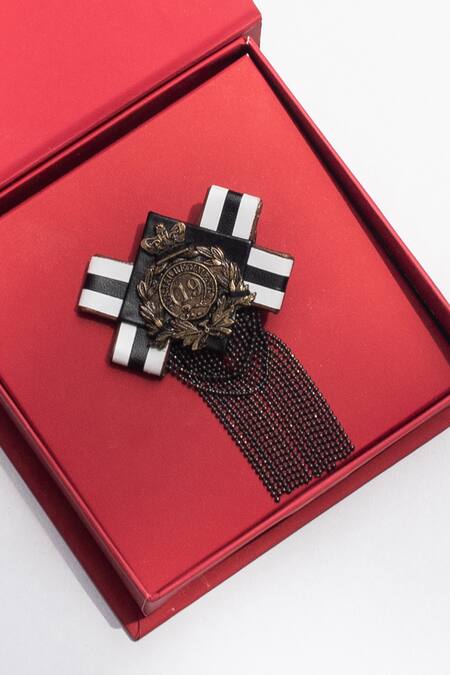 Shop S&N By Shantnu Nikhil Black Carved Work Crest Tasselled Brooch at Aza Fashions Shop_S&N By Shantnu Nikhil_Black Carved Work Crest Tasselled Brooch_at_Aza_Fashions
