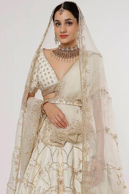 Sanjana Thakur Ivory Pure Raw Silk Hand Embroidered Aari Plunge V Neck And Bridal Lehenga Set at Aza Fashions Sanjana Thakur_Ivory Pure Raw Silk Hand Embroidered Aari Plunge V Neck And Bridal Lehenga Set _at_Aza_Fashions
