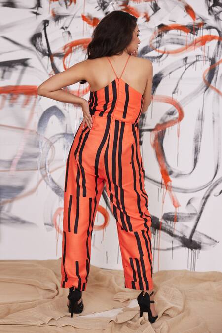 Shop Pooja Bagaria Orange Glazed Cotton Piano Striped Halter Neck Jumpsuit at Aza Fashions Shop_Pooja Bagaria_Orange Glazed Cotton Piano Striped Halter Neck Jumpsuit_at_Aza_Fashions