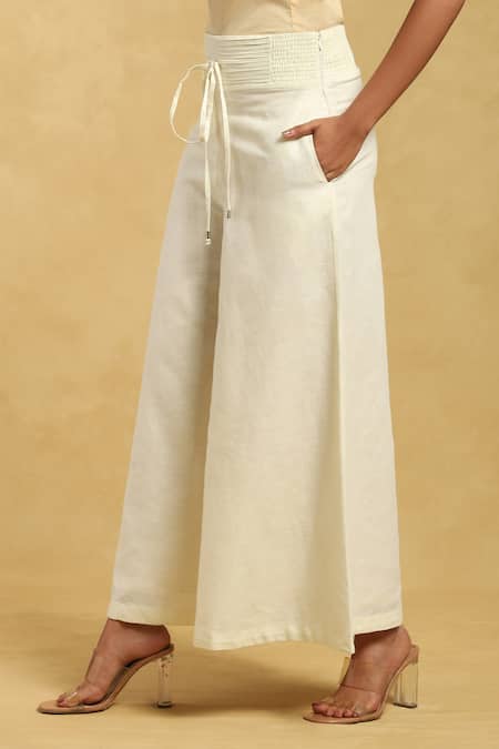 Buy Ritu Kumar Off White Cotton, Silk Pleated Waistband Solid Palazzo Online at Aza Fashions Buy_Ritu Kumar_Off White Cotton, Silk Pleated Waistband Solid Palazzo_Online_at_Aza_Fashions