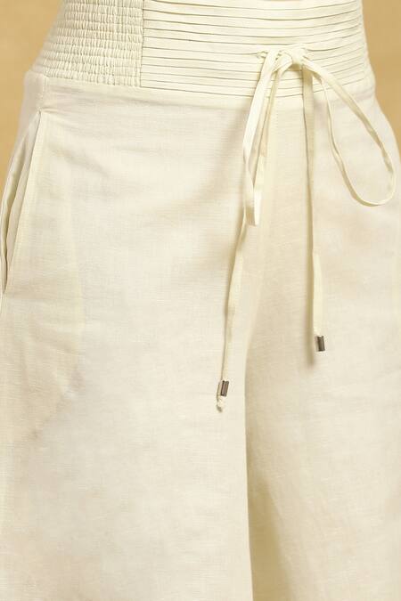 Ritu Kumar Off White Cotton, Silk Pleated Waistband Solid Palazzo at Aza Fashions Ritu Kumar_Off White Cotton, Silk Pleated Waistband Solid Palazzo_at_Aza_Fashions