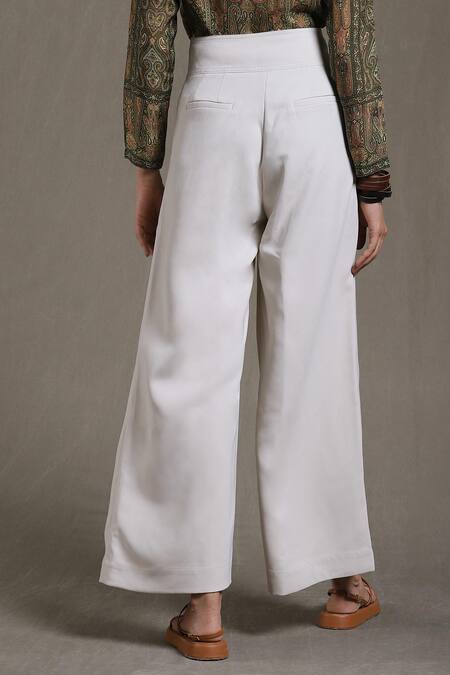 Shop Ritu Kumar Beige Polyester Solid Flared Pant at Aza Fashions Shop_Ritu Kumar_Beige Polyester Solid Flared Pant_at_Aza_Fashions