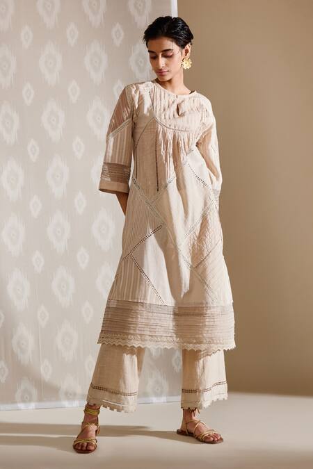 Buy Bunka Beige Voile Embellished Crochet Lace Keyhole Ezra Textured Tunic at Aza Fashions Buy_Bunka_Beige Voile Embellished Crochet Lace Keyhole Ezra Textured Tunic_at_Aza_Fashions