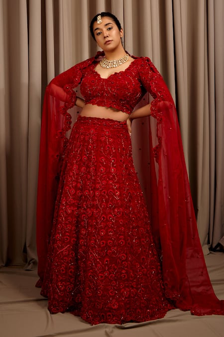 Photo of A beautiful bride in a stunning dark red lehenga and subtle makeup.