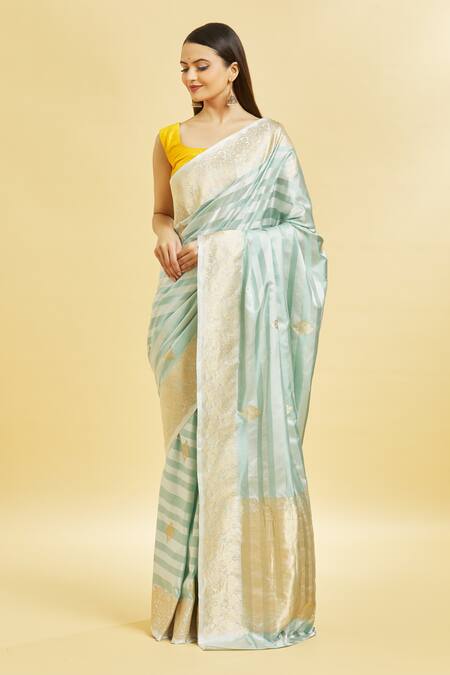 Mint N Oranges_Blue Silk Zari Round Neck Floral Pattern Saree With Blouse Piece_at_Aza_Fashions