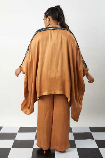 Shop Meesa Brown Silk Tassels Collared Asymmetric Shirt With Bootcut Pant at Aza Fashions Shop_Meesa_Brown Silk Tassels Collared Asymmetric Shirt With Bootcut Pant_at_Aza_Fashions