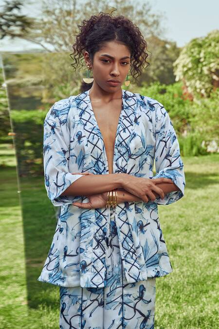 Shop_Mamicha_White Satin, Georgette Embroidery V-neck Floral Pattern Wrap Around Top_Online_at_Aza_Fashions