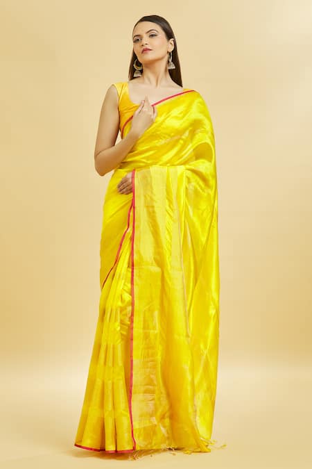 Mint N Oranges_Yellow Chanderi , Tassels Round Neck Plain Saree With Blouse Piece _at_Aza_Fashions